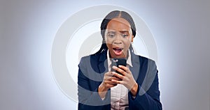 Wow, phone and confused black woman with omg face in studio with fake news, review or feedback on grey background