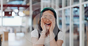 Wow, surprise and excited with a business Asian woman looking shocked by putting her hands on her face in expression