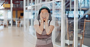 Wow, surprise and excited with a business asian woman looking shocked by putting her hands on her face in expression