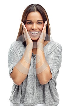 Wow, surprise and hands on face of woman in studio with shocking news, announcement or info on white background. Omg