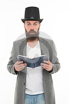 Wow. Surprised library reader. Hipster read library book. Bearded man wear top hat in casual style. Borrowing literature