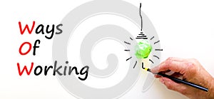 WOW ways of working symbol. Concept words WOW ways of working on a beautiful white background. Green light bulb icon. Businessman