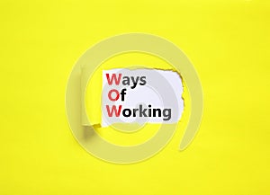 WOW ways of working symbol. Concept words WOW ways of working on white paper on a beautiful yellow background. Business and WOW