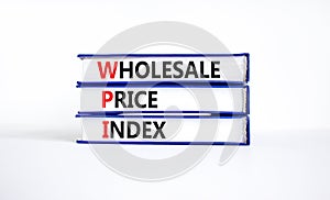 WPI wholesale price index symbol. Concept words WPI wholesale price index on books on a beautiful white table white background.