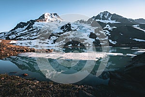 Wrangell-St. Elias National Park and Preserve, Alaska. Sunset view with glacier lake and glaciers with mountains and