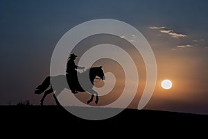 Wrangler riding horse sunset. Generate Ai