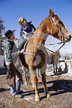 Wrangler talking to woman.