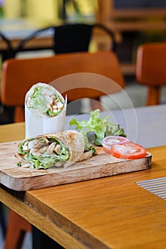 Wrap chicken or tasty kebab with vegetables