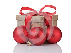 Wraped gift box with red bow and christmas balls