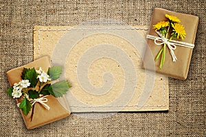 Wrapped boxes and paper card on canvas
