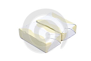 Wrapped butter sticks isolated on white