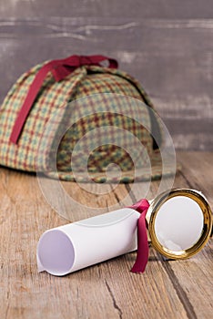 Wrapped paper sheets and magnifying glass