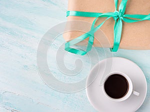 Wrapped surprise birthday holiday gift box and coffee