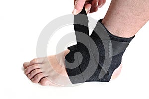 Wrapping a Black Ankle Brace photo