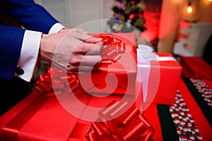 Wrapping gifts concept. Magic moments. Prepare surprise gifts for family and friends. Gift boxes with big ribbon bow