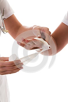 Wrapping a hand in bandage