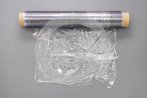 Wrapping plastic stretch film roll, abstract plastic waste concept. Copy space