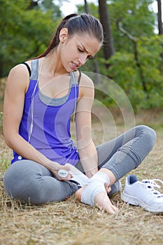 wrapping the sprained foot