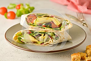 Wraps or torttila. Avocado, vegan wrap sandwiches. Healthy food