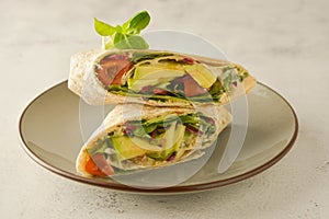 Wraps or torttila. Avocado, vegan wrap sandwiches. Healthy food