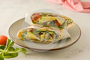 Wraps or torttila. Avocado, vegan wrap sandwiches. Healthy food