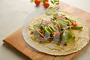 Wraps or torttila. Open avocado, vegan wraps. Healthy food. Copy space photo