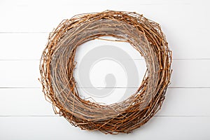 Wreath or circle framel from dry grape branches isolated on white background