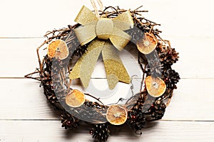 Wreath made of grape branches with dry citrus slices