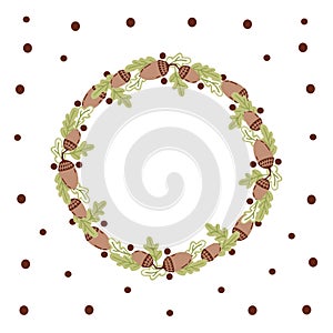 Wreath of oak leaves and acorns isolated on the white background with brown peas