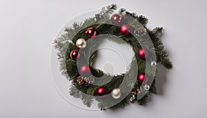 A wreath with red berries and pinecones