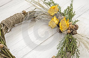 Wreath from a vine with roses. Handmade decor. Wreath of real twigs