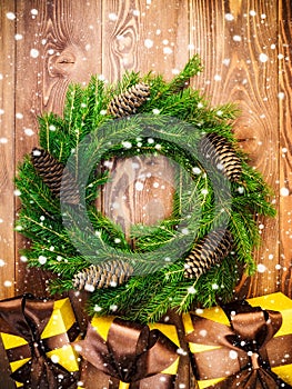 Wreath on the wooden board. Wrapped gift boxes. Christmas and New year concept