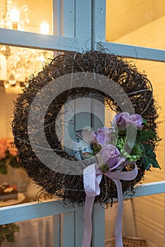 Wreath on a wooden door. Spring decoration.