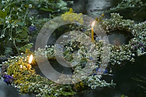 Wreathes witn candles on water