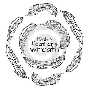 Wreaths of hand drawn feathers with boho pattern photo