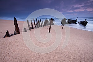 Wreck on australian beach at dawn
