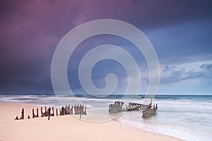 Wreck on australian beach at dawn