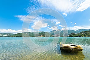 Wreck of a boat on the lake in perspective