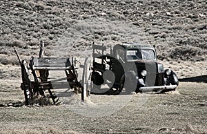 Wreck of cart and pick up in the ghost town of Bodie - California