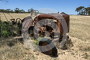 The wreck of a Fordson tractor in a paddock in Australia. photo