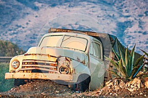 The wreck of an old rusty truck