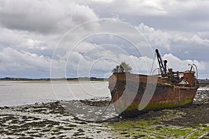 The wreck of the Portlairge rusting away on the beach at St Kieran`s Quay, Ballycullane in County Wexford.