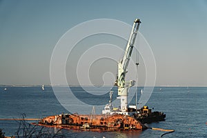 The wreck of tanker Delfi on Odessa beach. Ecological disaster, oil spill on city beaches as. Submerged oil tanker Delfi near