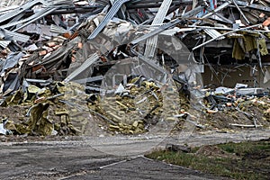 the wreckage and ruins of a destroyed concrete building in city center photo