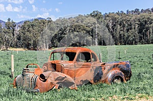 Wrecked, rusted car in an Australian field near Marysville
