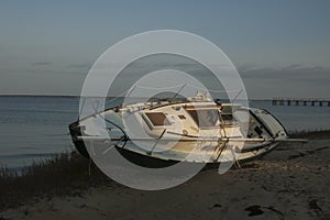 Wrecked sailboat washed ashore