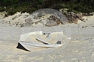 Wrecked small boat on a beach