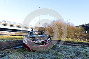 Wrecked stolen car, with graffiti