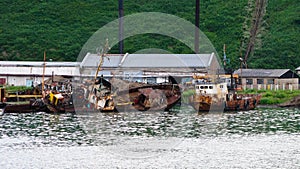 Wrecking ships at the Malokurilscoe harbour, Shikotan island, Kuril, Sakhalin, Russia photo