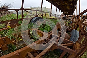 The wrecks of the buses standing on the vehicle cemetery.